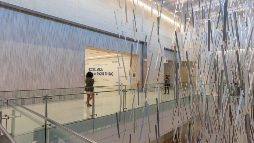 Photo of Capital One office interior with large art display. Photo of Capital One office interior with large art display.